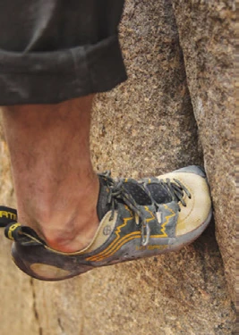 A climbing shoe rotated into a crack and jammed against the crack walls