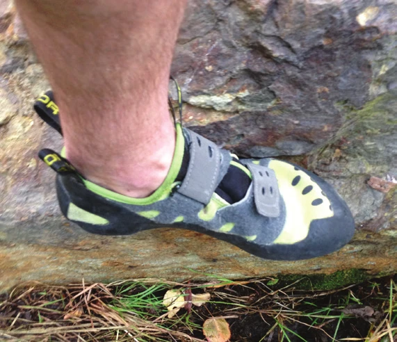 A climbing shoe using its outside edge on a hold, heel angled away from the rock